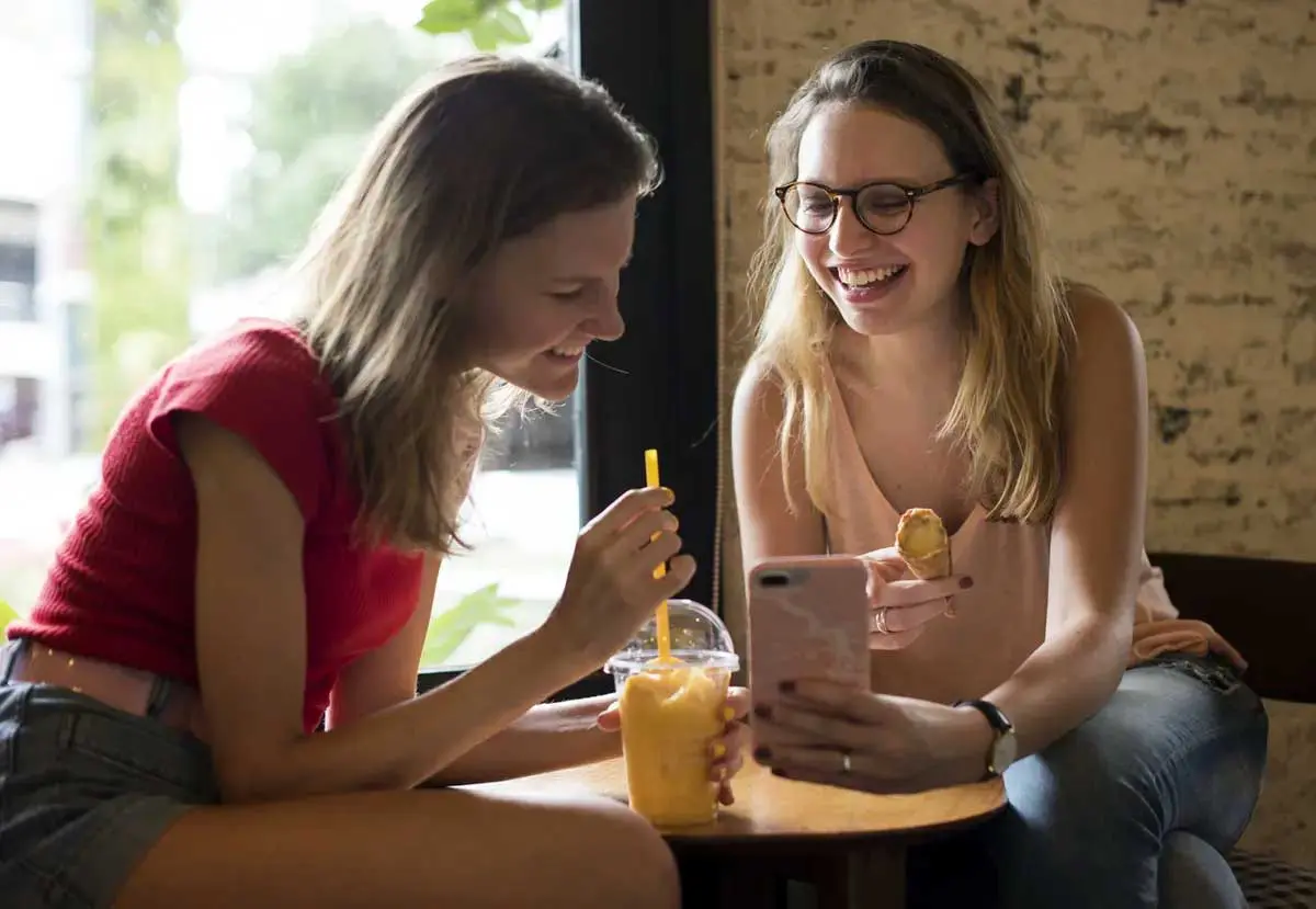 Students smiling and having a snack